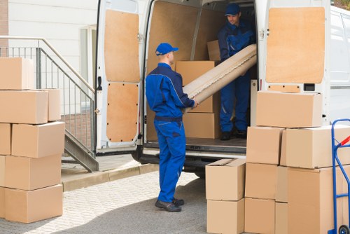 Removal team planning a Bermondsey home move with boxes and a van