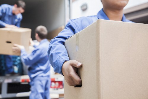 Professional office relocation services in Bermondsey with moving team and office equipment