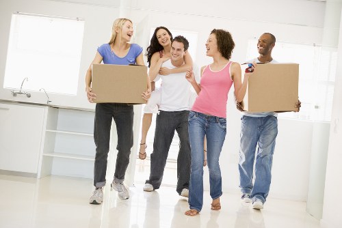 Team member loading boxes safely into a moving van