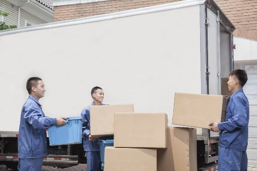 Removal van and movers in a Bermondsey residential street