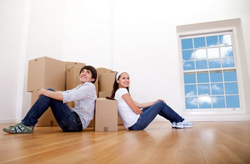 Unpacking boxes in a Bermondsey home with organised moving support