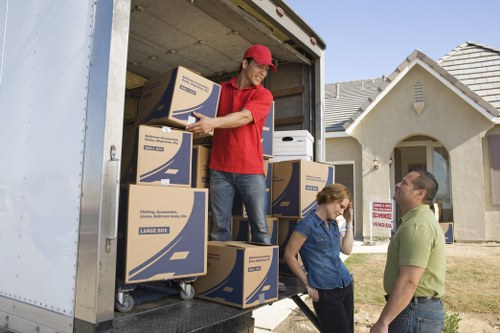 Professional movers handling boxes during a Bermondsey same day relocation